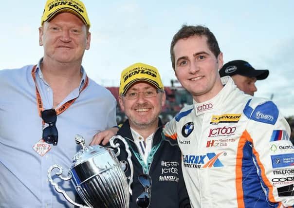 Sam Tordoff with his father John, CEO of JCT600, and the MD of GardX with the 2016 BTCC Team champions trophy. PIC: Dennis Goodwin