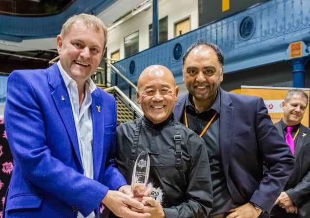 AWARD: Sir Gary Verity, Ken Hom and Zulfi Karim, founder of the World Curry Festival.