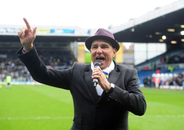 Vinnie Jones sings Marching On Together at Leeds United's match with Millwall in March 2014. He is backing Garry Monk to succeed at Elland Road. Picture: Tony Johnson
