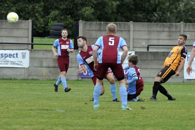 Joe Turfrey shoots high for Ossett Albion against second division visitors Rawdon OB.
