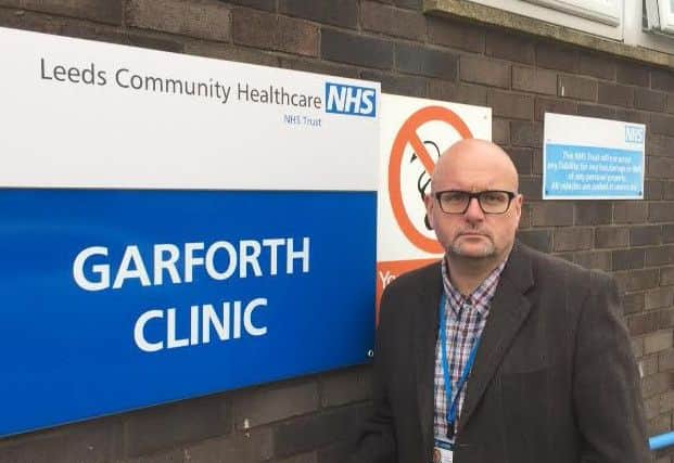 Coun Mark Dobson outside the now-closed clinic.