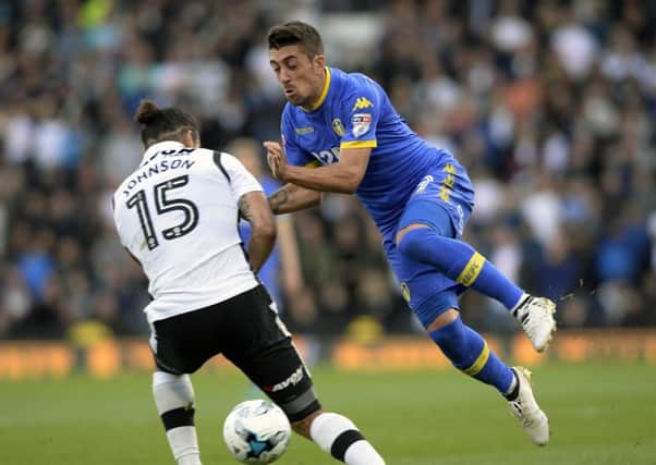 Pablo Hernandez jumps to avoid a challenge from Bradley Johnson. PIC: Bruce Rollinson