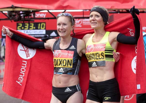 Great Britain's Aly Dixon (left) and Sonia Samuels celebrate after crossing the line during the 2016 Virgin Money London Marathon. PRESS ASSOCIATION