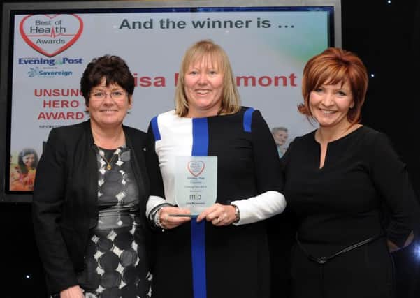 Unsung Hero Award winner Lisa Beaumont is presented with her award by Jane Carter and Clare Frisby