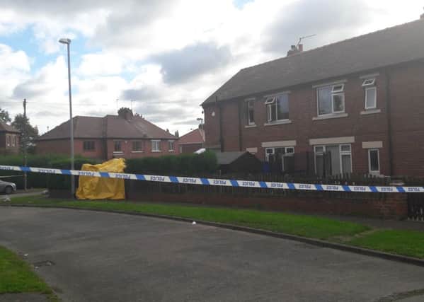 Scene of police cordon following the death of two people in a house fire in Stanley.