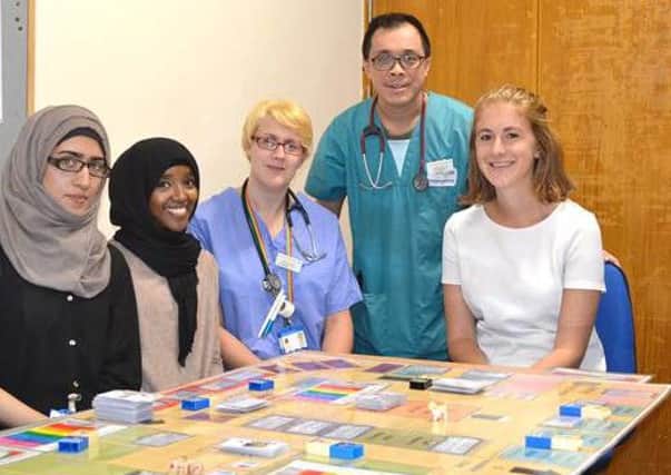 Staff at Mid Yorkshire Hospitals NHS Trust playing a new game designed to prepare them for the busy winter months in emergency departments.