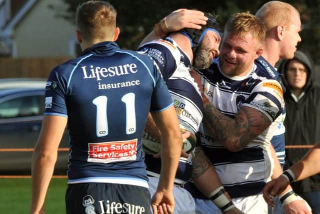 Yorkshire Carnegie prop Rob O'Donnell (centre) is congratulated on his third of four tries scored against Bedford Blues.