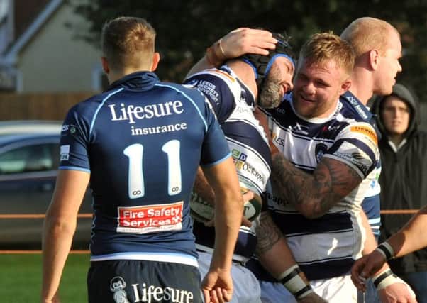 Yorkshire Carnegie prop Rob O'Donnell (centre) is congratulated on his third of four tries scored against Bedford Blues.
