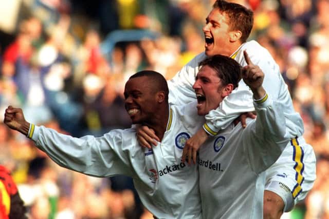 Rod Wallace celebrates with Lee Sharpe and Andy Couzens.
