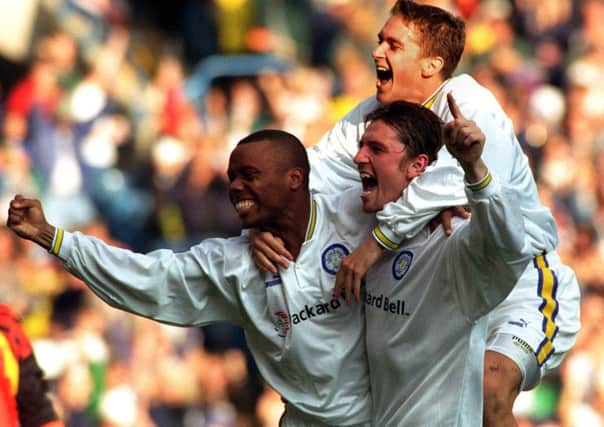 Rod Wallace celebrates with Lee Sharpe and Andy Couzens.