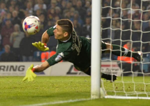 Marco Silvestri makes his third save in the penalty shootout against Norwich City.