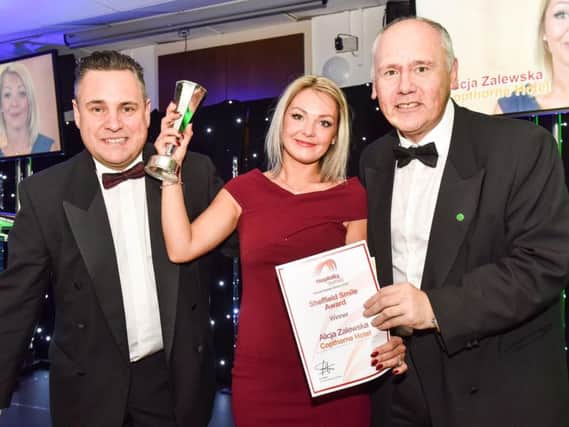 Smile...you're our winner. Hospitality Sheffield Smile Award 2016 winner Alicja Zalewska with event host Tom Ingall and The Star's Graham Walker