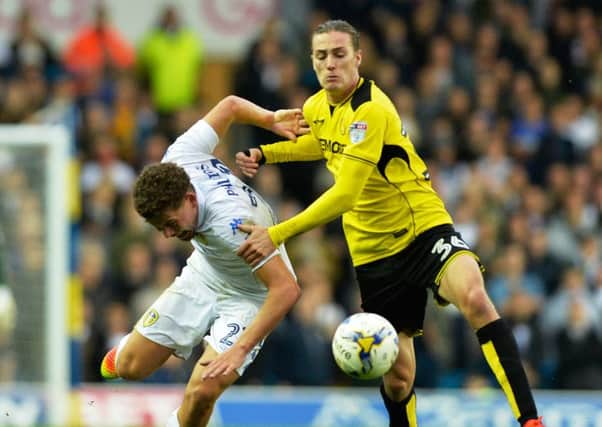 Kalvin Phillips is manhandled to the ground by Jackson Irvine.
 PIC: Bruce Rollinson