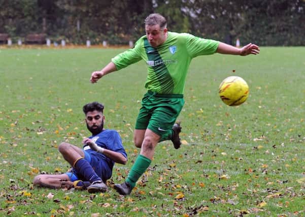 Farnley Sports' Danny Purcell is tackled by Aaron Moore, of North Leeds. PIC: Steve Riding