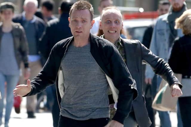 Actors Ewan McGregor (front) and Ewan Bremner (behind) running through the streets of Edinburgh where scenes for the new Trainspotting 2 is being filmed. PRESS ASSOCIATION Photo.