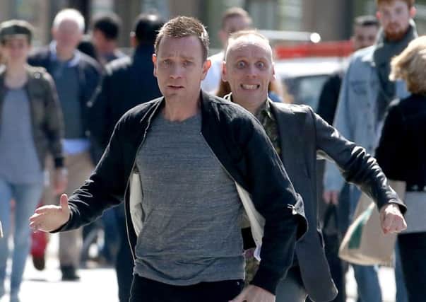Actors Ewan McGregor (front) and Ewan Bremner (behind) running through the streets of Edinburgh where scenes for the new Trainspotting 2 is being filmed. PRESS ASSOCIATION Photo.
