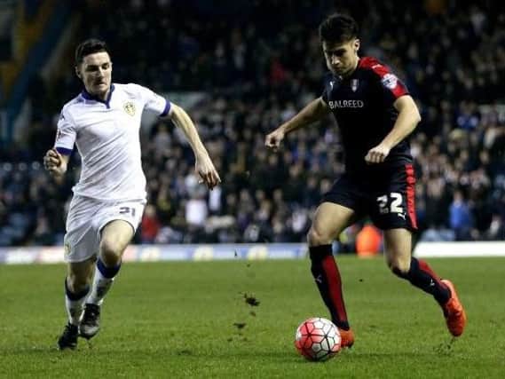 Leeds United defender Lewie Coyle (left) who has signed a two-year contract extension.
