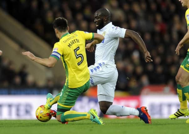 Souleymane Doukara is challenged by Russell Martin. PIC: Simon Hulme