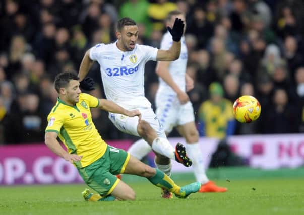 Kemar Roofe is challenged by Wes Hoolahan. PIC: Simon Hulme