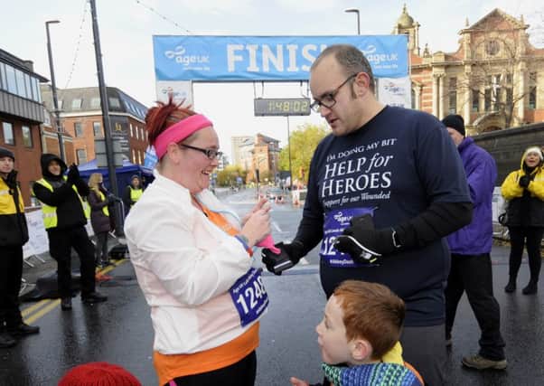 Matthew Waddingham proposes to Sarah on the finish line. PIC: Simon Hulme