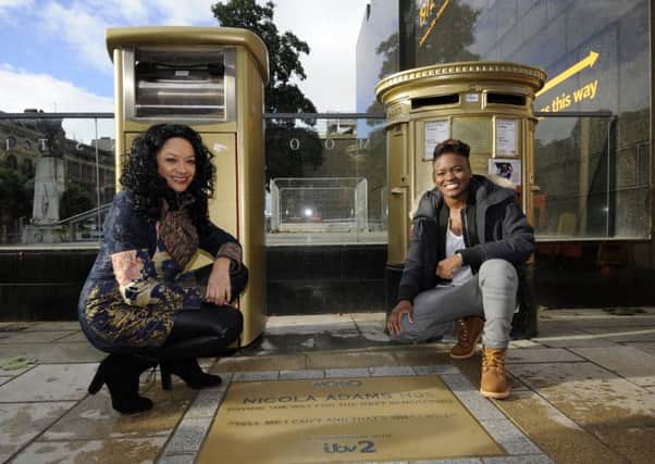 Olympic Gold Medalist Nicola Adams is pictured with MOBO awards founder Kanya King and her gold paving stone on Cookridge Street. PIC: Simon Hulme