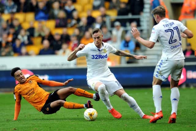 IN THE THICK OF IT: Pontus Jansson battles with Wolves Helder Costa. Picture: Jonathan Gawthorpe