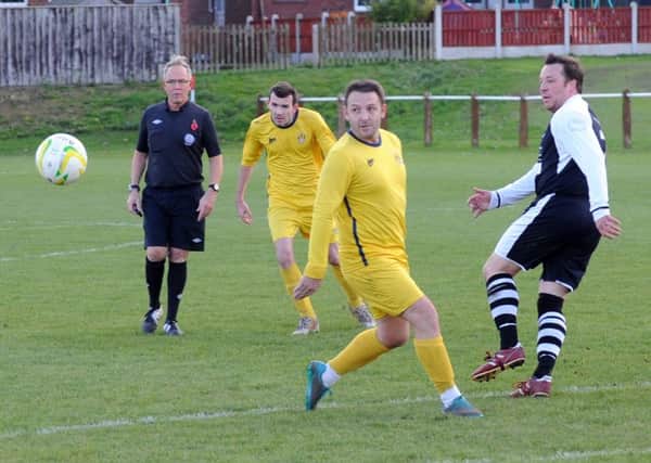 A deft pass from Alan Laud of Hall Green United against visiting Old Centralians. PIC: Steve Riding