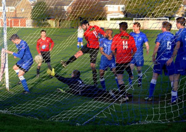 Jonny Downey claims his hat-trick with the match-winning goal for East Ardsley Wanderers in a 3-2 victory over visitors FC Headingley. PIC: Steve Riding