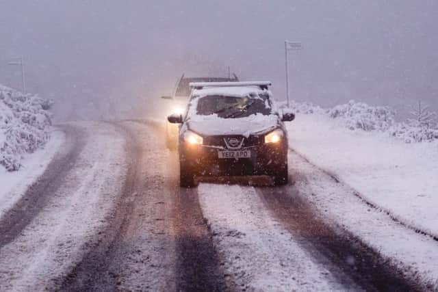 Commuters battle their way to work on a snowy morning on Ilkley Moor. PIC: SWNS