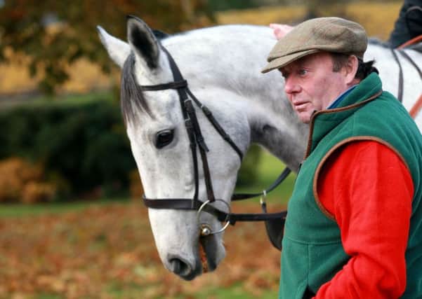 Trainer Nicky Henderson with Simonsig.