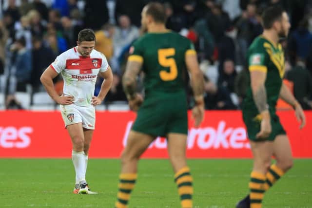England captain Sam Burgess (left) appears dejected after defeat against Australia at London Stadium. Picture: Nigel French/PA