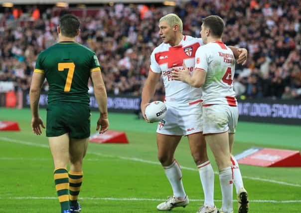 TOO LITTLE, TOO LATE: Ryan Hall is congratulated by Mark Percival after scoring his side's third try against Australia  at London Stadium. Picture: Nigel French/PA