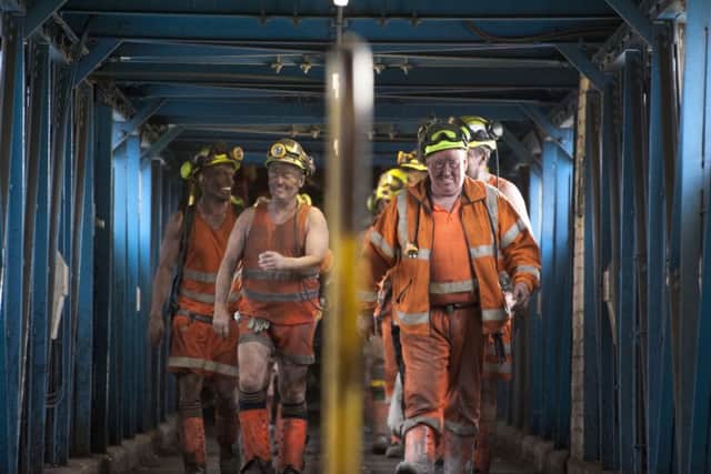 Some of the last miners at Kellingley Colliery coming off a shift. Picture by Roger Tiley.