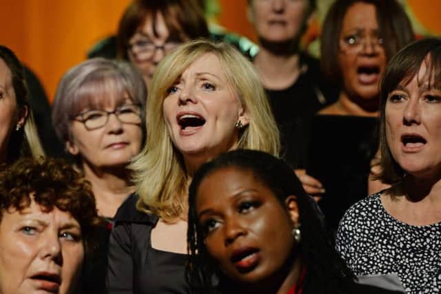 Tracy Brabin MP (centre) joins other politicians and members of the Royal Opera House Thurrock Community Chorus to record a charity single for the Jo Cox Foundation at the Backstage Centre in Purfleet, Essex, the single, which will be released next year, to mark the launch of the Jo Cox Foundation - a charity raising funds for causes close to the late Batley and Spen MP. PRESS ASSOCIATION Photo. Picture date: Thursday November 17, 2016. Politicians and stars from the world of music have joined forces to record a charity single in memory of the late Jo Cox. Kaiser Chiefs' Ricky Wilson, singer-song writer KT Tunstall, Cockney Rebel's Steve Harley and pop star David Gray are among those taking part in the special recording of The Rolling Stone's You Can't Always Get What You Want. See PA story SHOWBIZ Cox. Photo credit should read: Victoria Jones/PA Wire