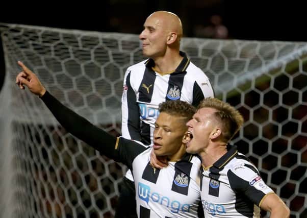 Newcastle United's Dwight Gayle celebrates his second goal against Barnsley with Matt Ritchie and Jonjo Shelvey. (Picture: Richard Sellers/PA Wire)