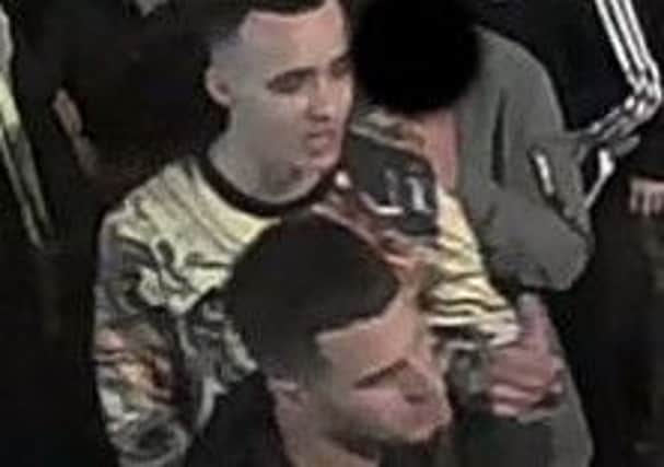Police would like to speak to these two men after a report of witness intimidation on Briggate in Leeds.