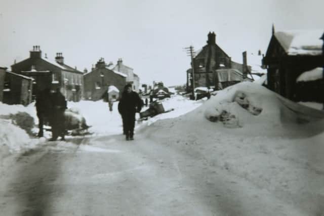 28/1/10  The winter of 1947  in Hawes  main street , a horse is pulling a sledge on the left of the phoptograph,  the photograph is owned by Mary  Metcalfe from Threshfield.