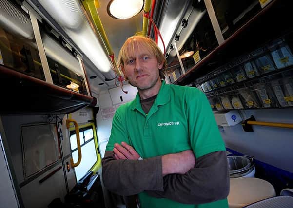 Tim Gibson in his second hand ambulance which he uses for his work with Cryonics UK.