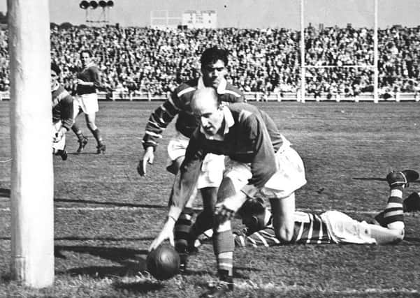 1956: Lewis Jones of Leeds RL places the ball under the posts  at Headingley.