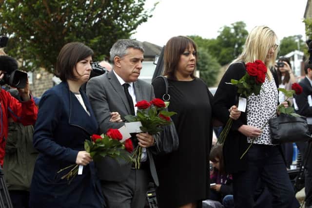 (From the left) Lucy Powell MP, Jeff Smith MP, Paula Sherriff MP and Karen Rawling lay floral tributes in Birstall, West Yorkshire, after Labour MP Jo Cox was killed.