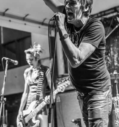 Richie Ramone on stage with bassist Clare Misstake.