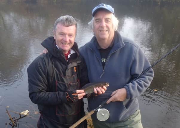 Leeds and Districts new vice president Dave Rushton with new president Paul Roberts get in on the grayling action at Linton on Wharfe.