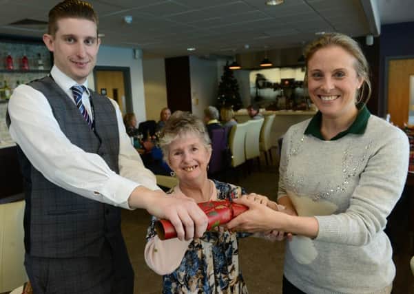 28 Nov 2016.....Christmas meal at Leeds City College for some Leeds hospital patients who have completed treatments for head and neck cancer. L-R Luke Hepworth (Leeds City College), Pat Lee-Preston (patient) and Jennifer Carne (Macmiilan) Picture Scott Merrylees