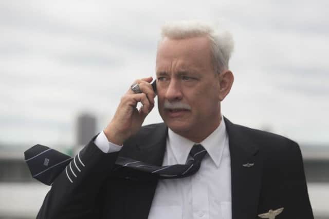 This image released by Warner Bros. Pictures shows Tom Hanks in a scene from the film, "Sully." The movie opens in U.S. theaters Friday, Sept. 9, 2016. (Keith Bernstein/Warner Bros. Pictures via AP)