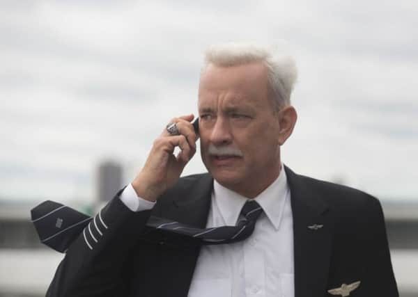 This image released by Warner Bros. Pictures shows Tom Hanks in a scene from the film, "Sully." The movie opens in U.S. theaters Friday, Sept. 9, 2016. (Keith Bernstein/Warner Bros. Pictures via AP)
