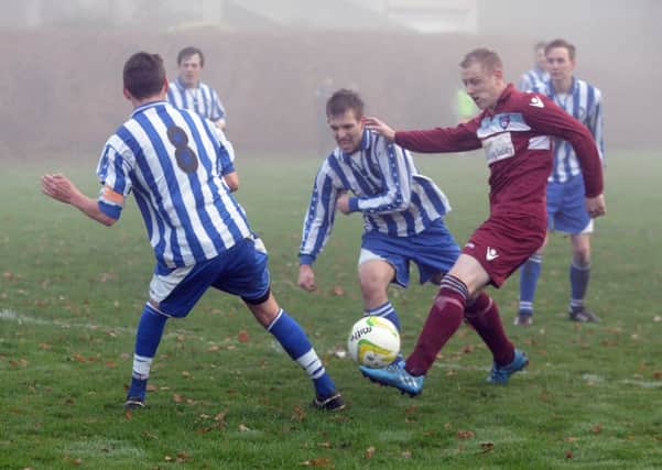 Ryan Gosney shoots for  AFC Hosforth in their match against  Altofts in West Yorkshire League Division 2.