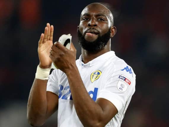Souleymane Doukara applauds the Leeds travelling support after the match (Photo PA)