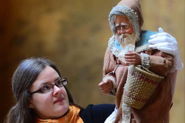 Curator Eleanor Matthews with a plaster figurine of Santa which has been discovered at Brodsworth Hall. Picture Scott Merrylees