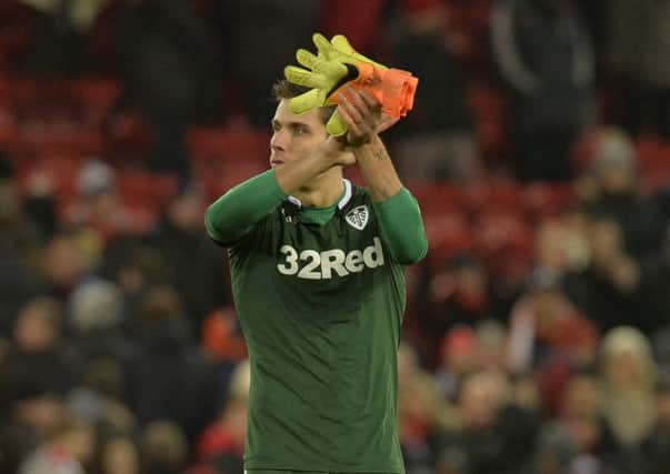 Marco Silvestri salutes the Leeds United fans at Anfield.