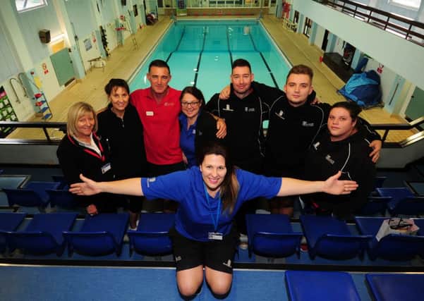 GET INVOLVED: Lifeguard Clare Brook with staff at Pudsey Lesiure Centre, which has recently undergone a revamp. PIC: Simon Hulme